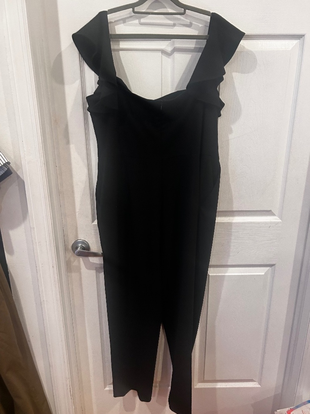 Calvin Klein black jumpsuit with ruffle sleeves